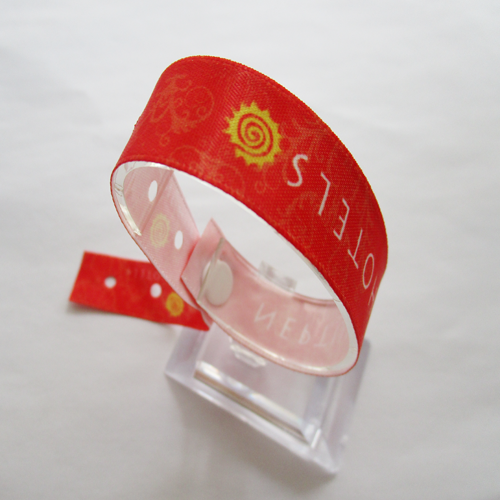 satin wristband with one time use PVC button