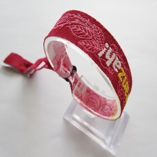 woven wristband with one time use plastic oval slid closure